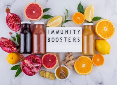 top-view-immunity-boosting-foods-juice-with-citrus-ginger_23-2149211491